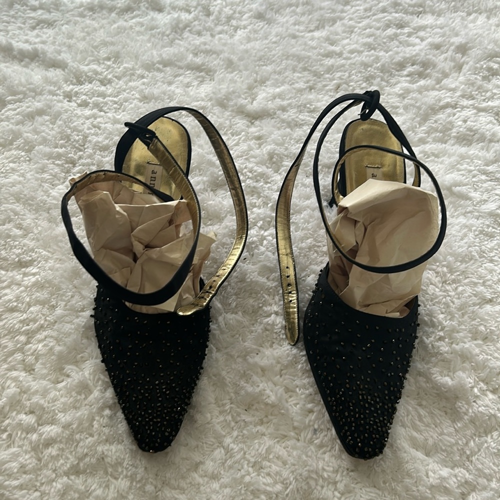 Black Beaded heels that wrap around ankle to close. 7M